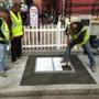 Workers applied the Cambridge Poetry Program test stamp into freshly poured concrete last April. 
